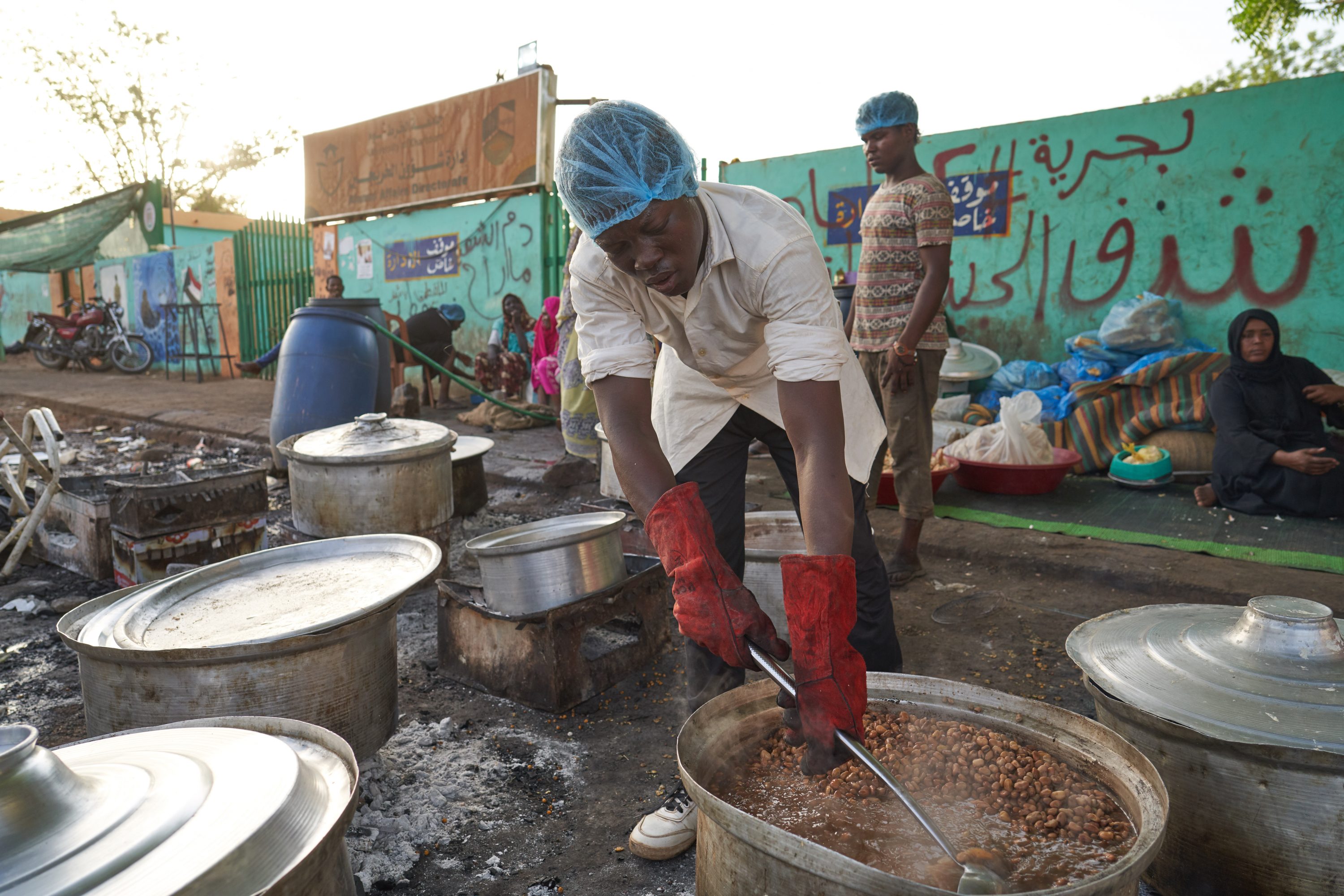 Volunteers cook for protesters at the Sit-In