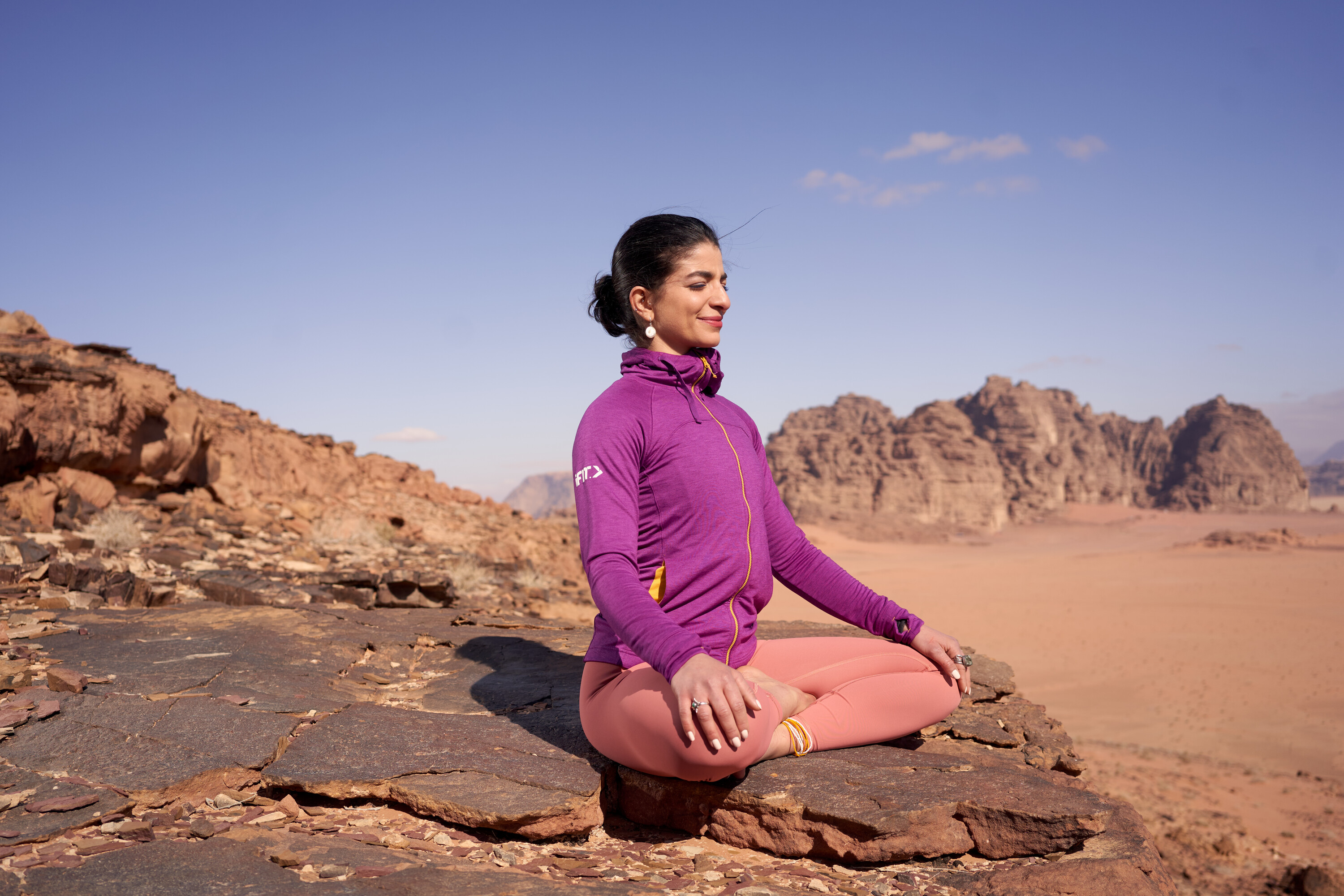 Yoga poses in Wadi Rum of Jordan.