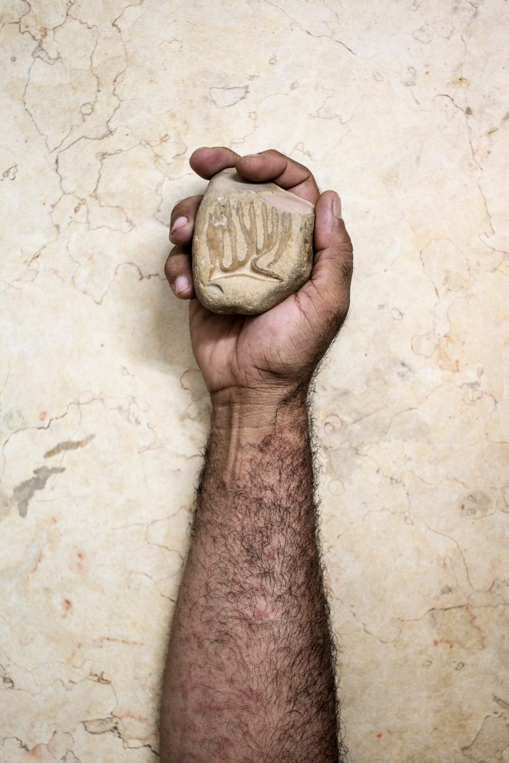 Nour al-Dein Zaki sees this stone as a modern miracle that appears to include Arabic script.