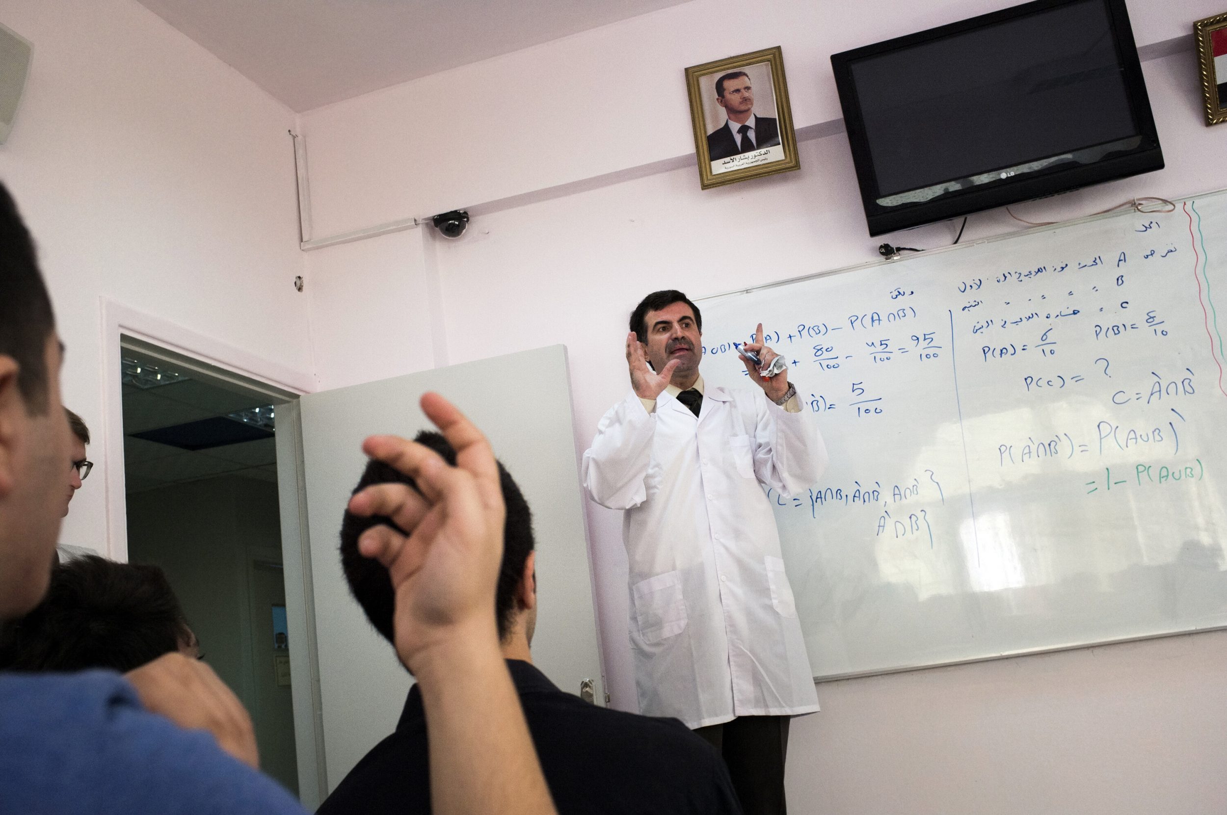 Bunat Alajial school sit in a math class in Damascus, Syria.