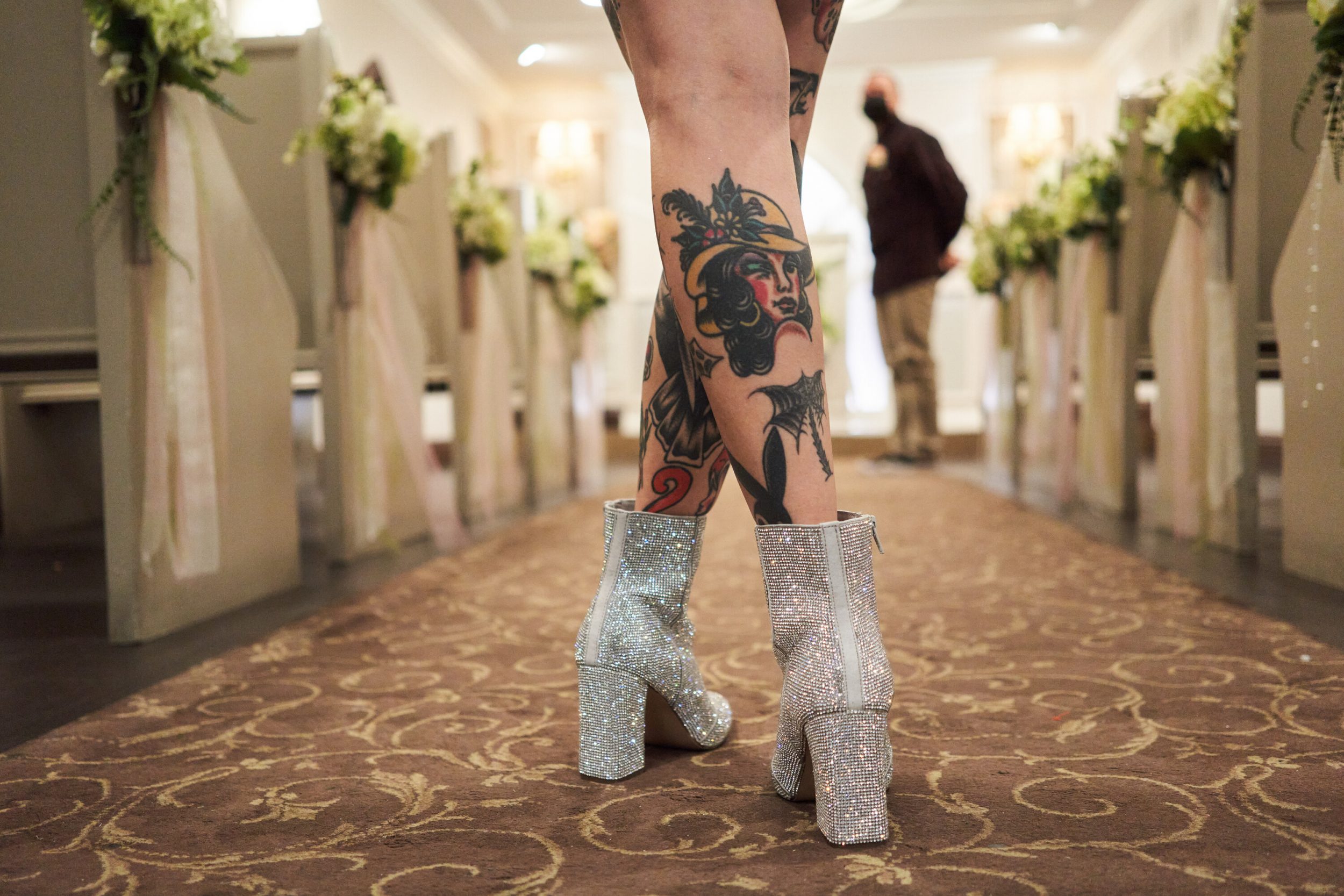 Samara Lovell stands at the back of the Graceland Wedding Chapel waiting for the music to start before walking with an Elvis impersonator down the aisle to marry Vincent Croff.