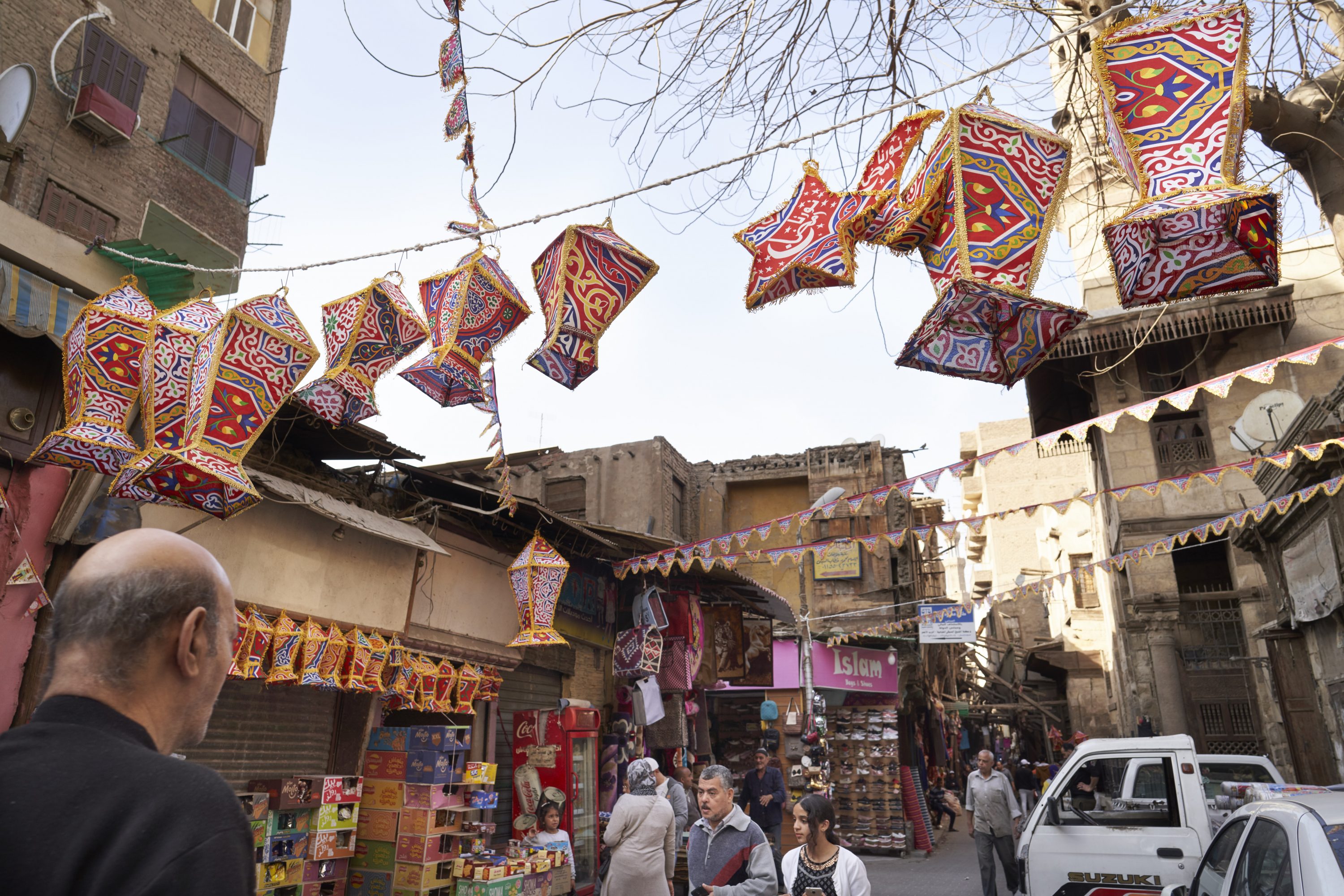 Cloth Ramadan lanterns hang over the Al-Khayama street in Darb Al-Ahmar