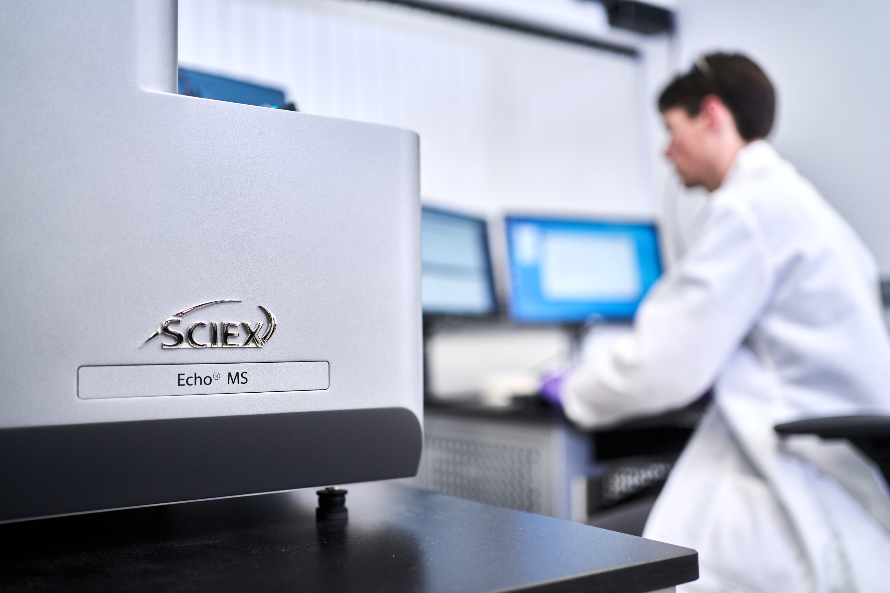 SCIEX mass spectrometry lab equipment with researcher for pharmaceutical photography