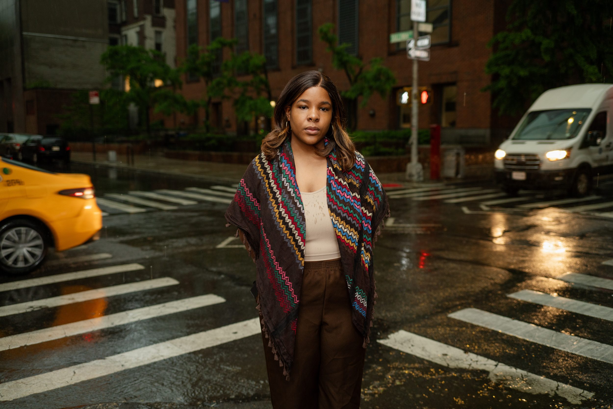 Editorial portrait of Ryna Workman, an NYU student who was barred from commencement and lost a job offer due to controversial statements about Israel, faces uncertainty about their degree after three years of study and $300,000 in expenses.