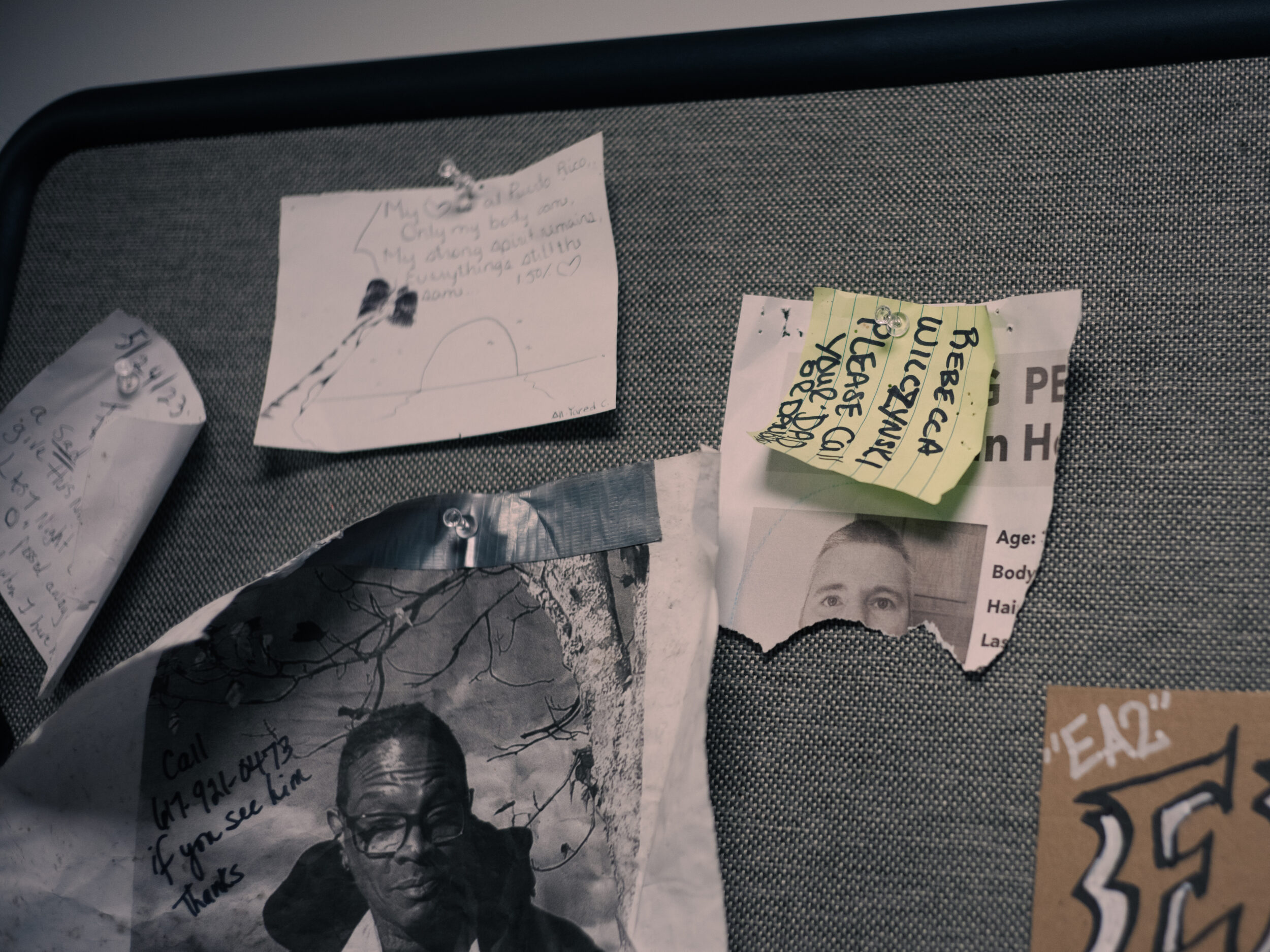 A torn missing persons flyer for Bryan Hogan is pinned to a bulletin board at the AHOPE needle exchange in Boston A torn missing persons flyer showing Bryan Hogan's eyes is pinned to a bulletin board alongside other handwritten notes and pleas at the AHOPE needle exchange.