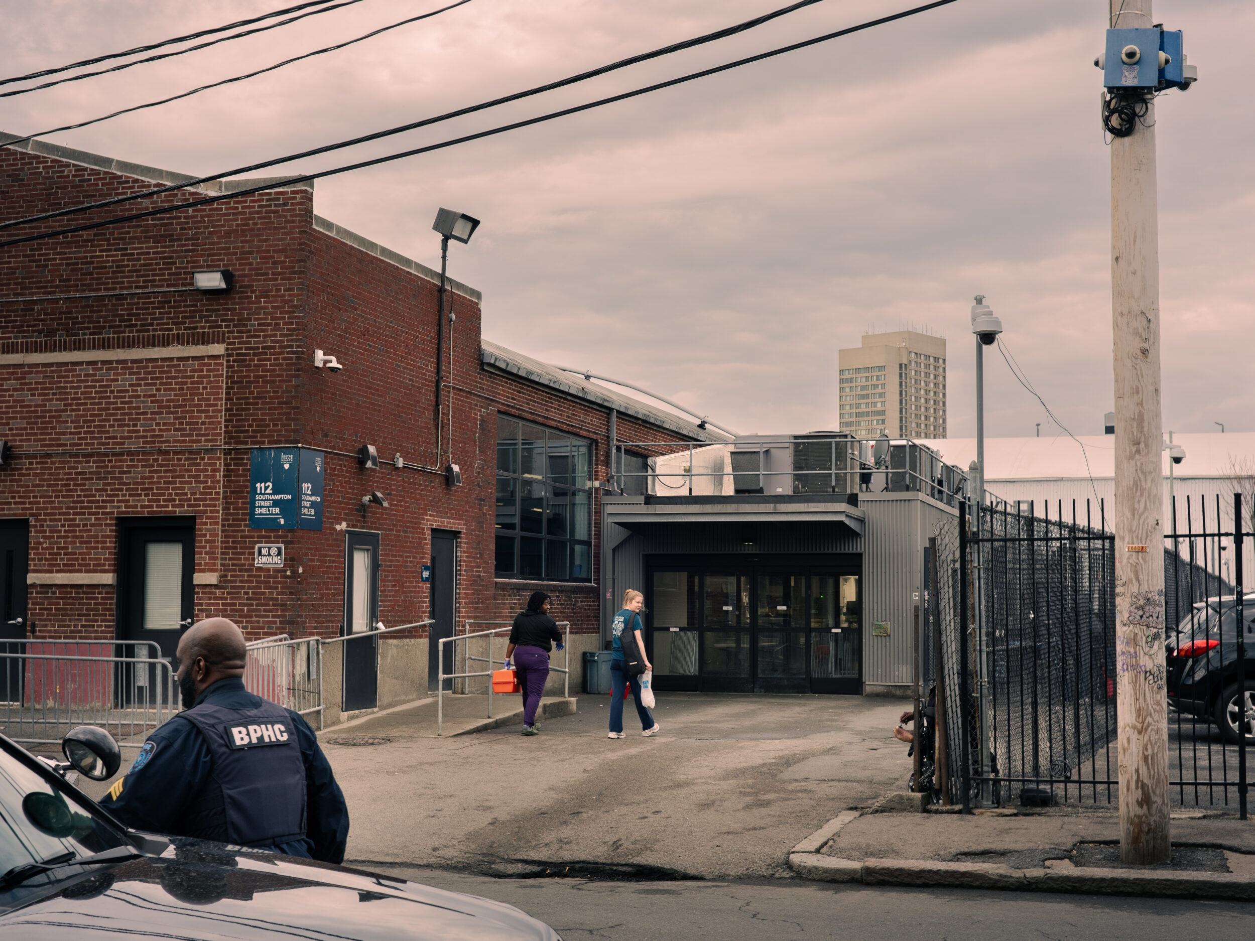 A Boston Public Health Commission officer stands outside the Southampton Street Shelter in Boston A Boston Public Health Commission officer stands outside the Southampton Street Shelter