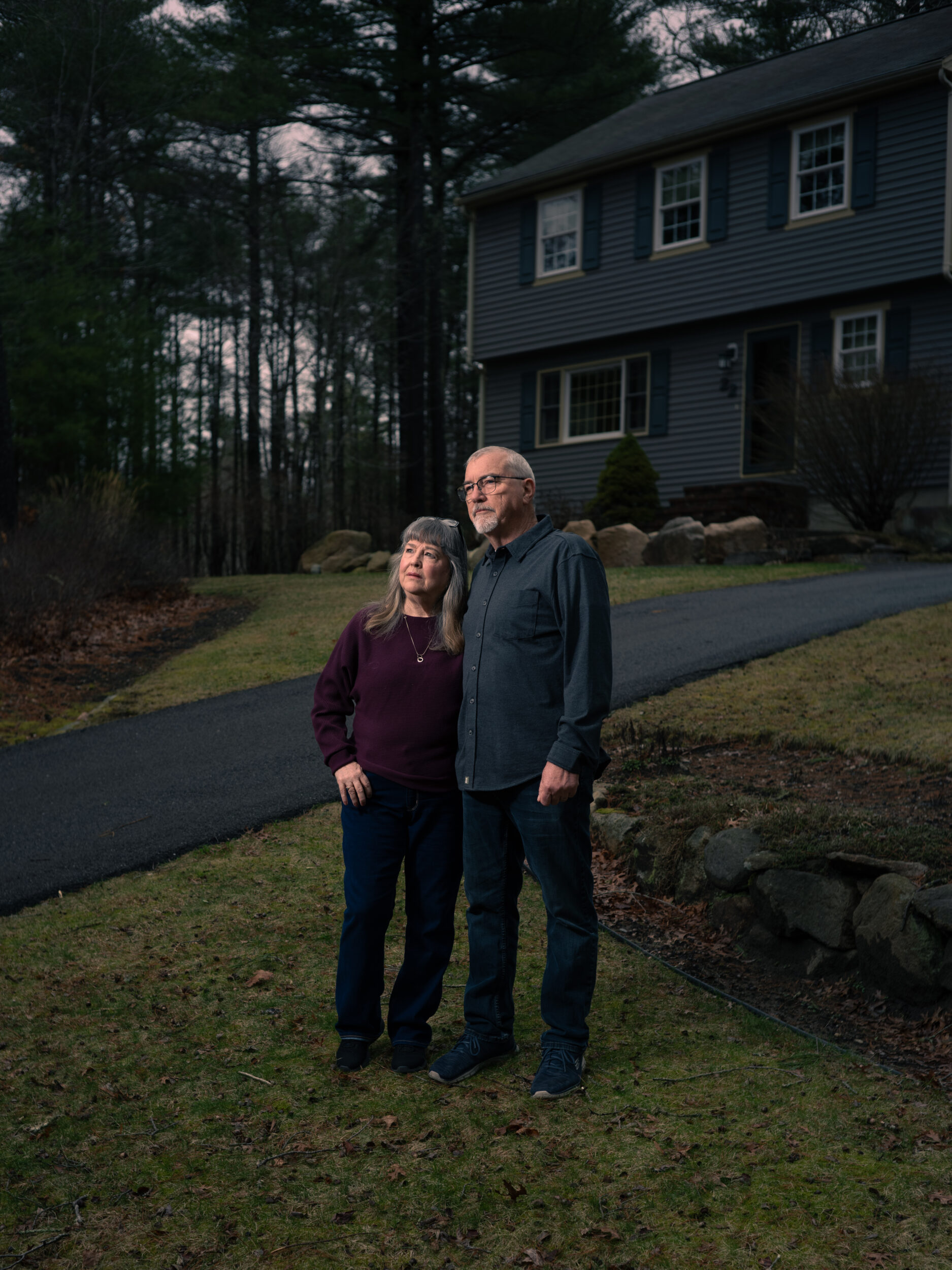 Jan and Chris Hogan stand outside their home in Wareham, where they have waited more than four years for their missing son Bryan to return
