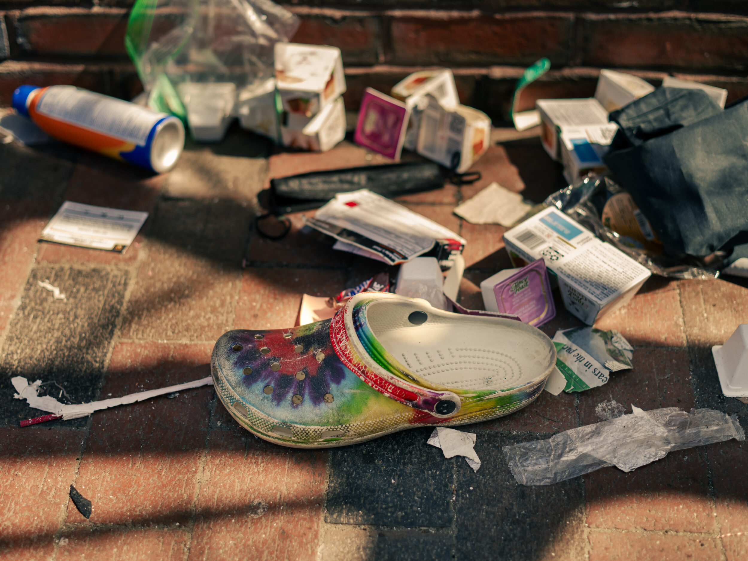 A pile of trash at a bus stop on Massachusetts Avenue near the health center in Boston A pile of trash at a bus stop on Massachusetts Avenue near the health center in Boston