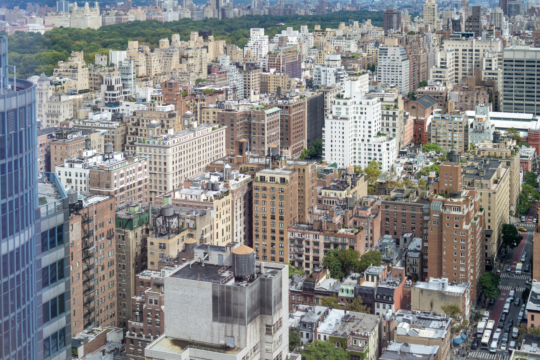 A dense grid of New York streets and buildings viewed from above.