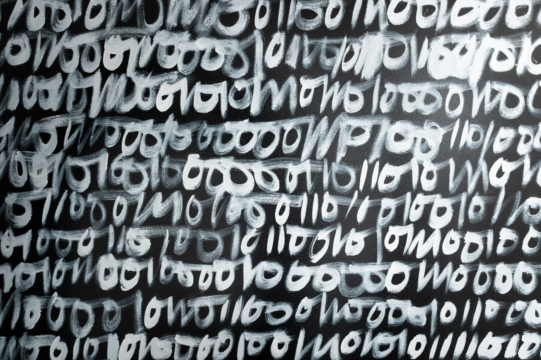 Rows of black and white repeated letterforms fill a canvas.