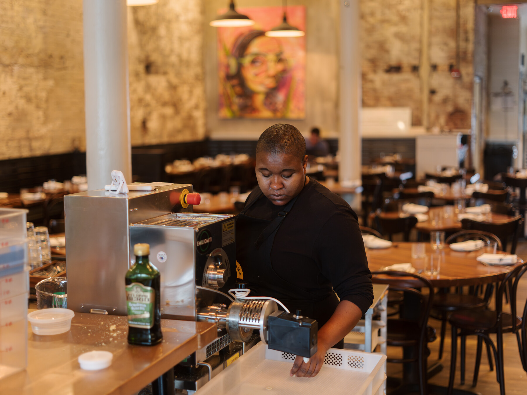 Ezra Kukis works beside a pasta extruder in Chitarra Pastaria’s Cambridge workspace.