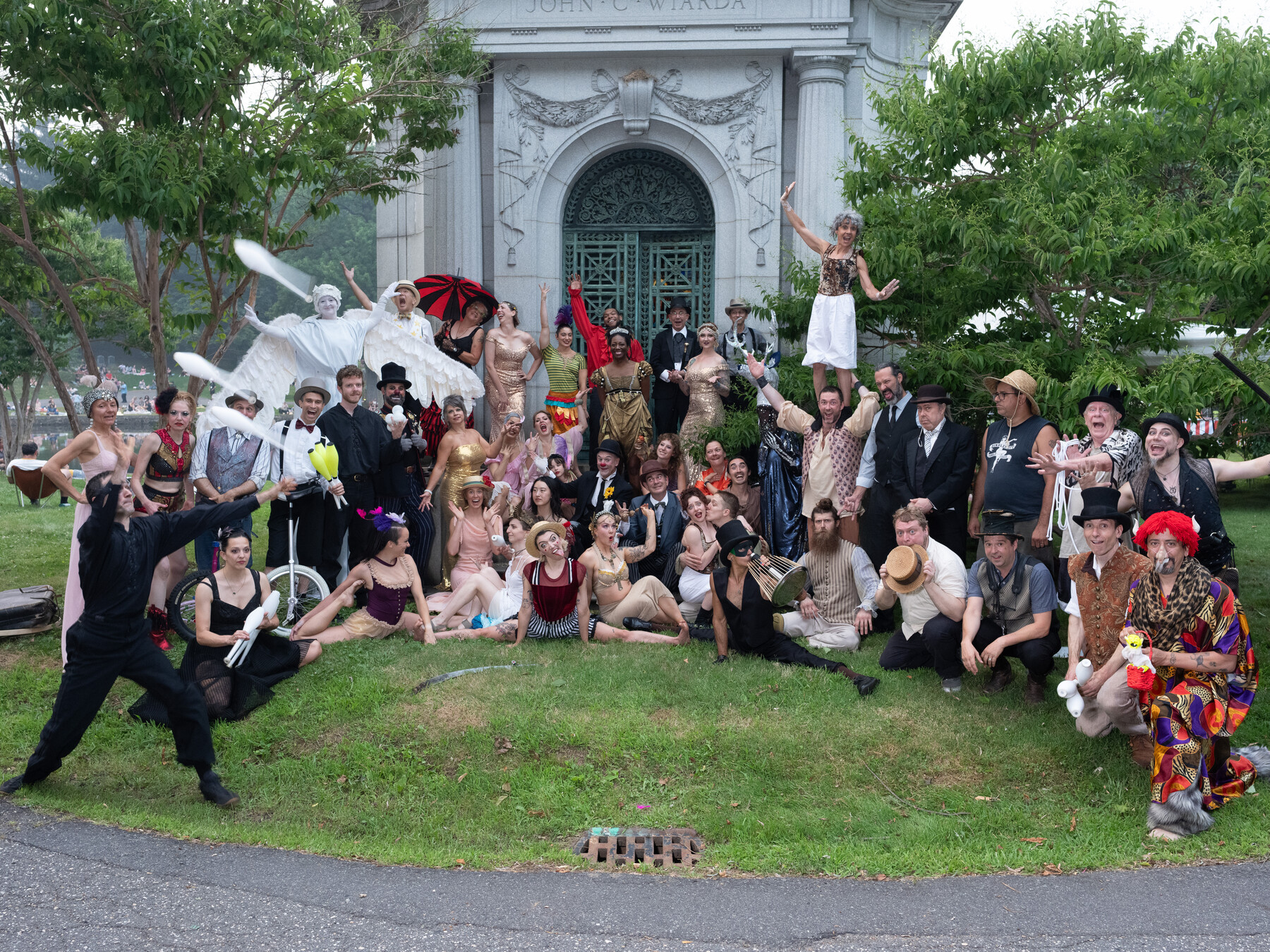 Bindlestiff performers gather for a group portrait in front of the Niblo mausoleum.