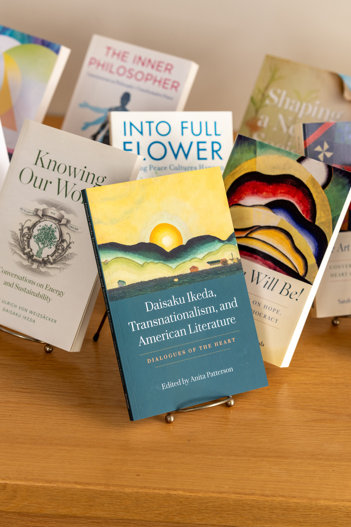 Daisaku Ikeda, Transnationalism, and American Literature in front of other displayed books.