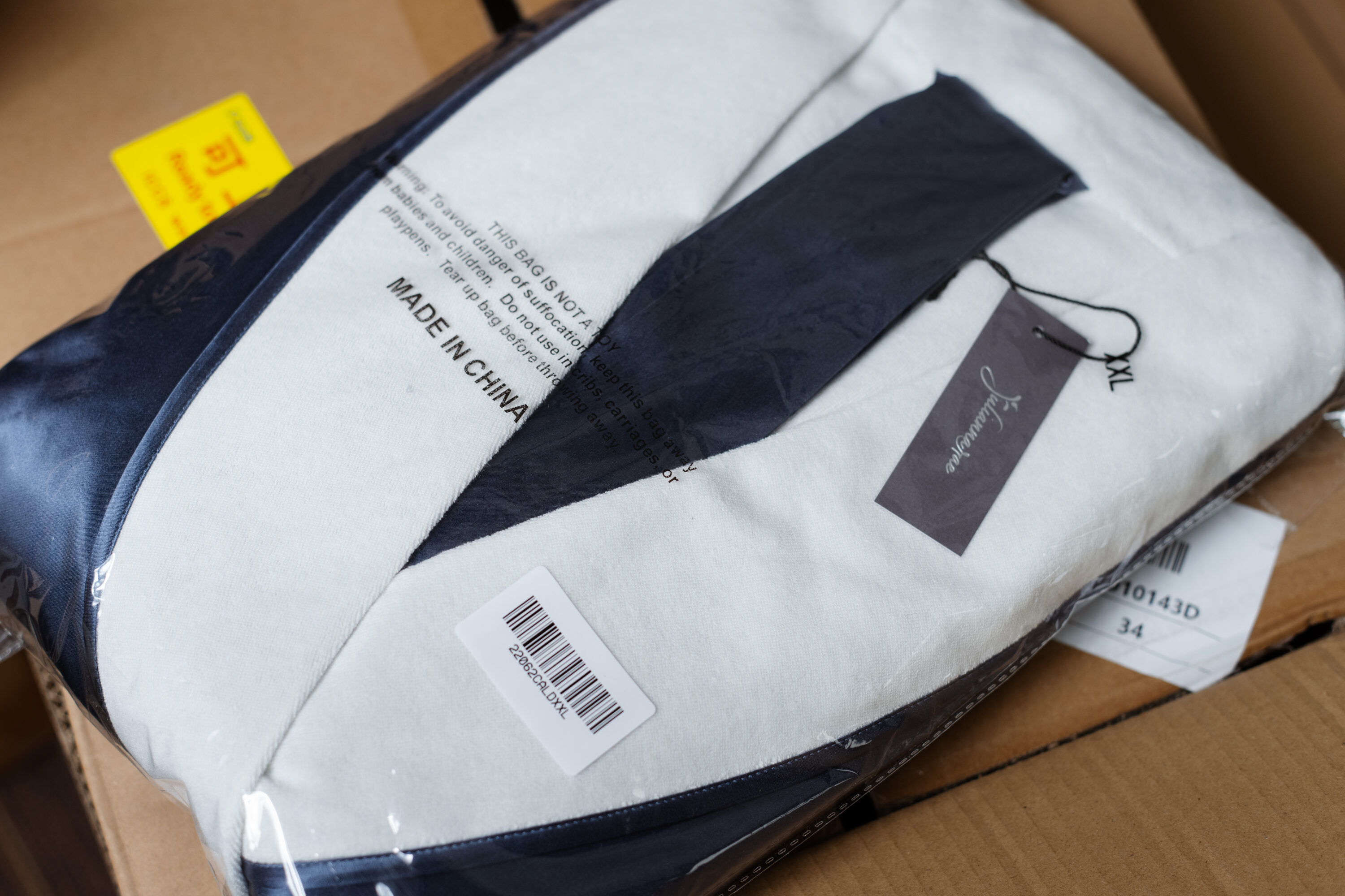 A garment package inside a carton bears the words Made in China.